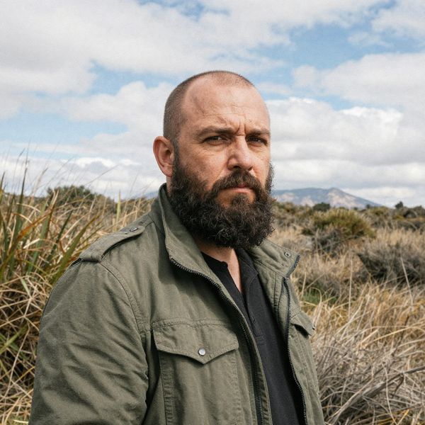 AI image generated by Z-Image Turbo, ranked #9 of 15 in the "Bald man challenge" arena challenge — prompt: Give the person a full, thick head of natural hair with realistic texture, density, and a natural hairline. Preserve facial features and lighting.