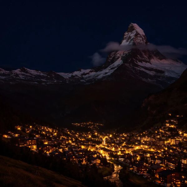 AI image generated by FLUX.2 [flex], ranked #15 of 16 in the "Night Sky Transformation" arena challenge — prompt: Change the scene to night: a deep, dark sky with subtle, glistening stars visible behind the mountain.