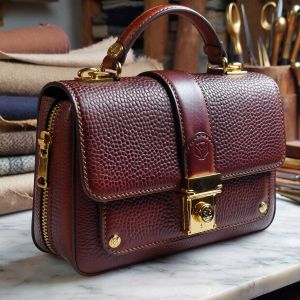 A hyper-realistic, close-up shot of a high-end designer l...