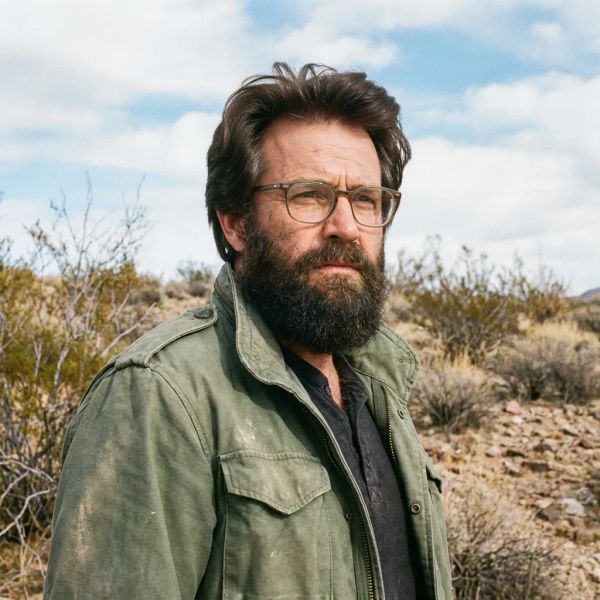 AI image generated by FLUX.2 [max], ranked #10 of 15 in the "Bald man challenge" arena challenge — prompt: Give the person a full, thick head of natural hair with realistic texture, density, and a natural hairline. Preserve facial features and lighting.