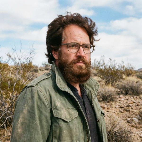 AI image generated by FLUX.2 [pro], ranked #12 of 15 in the "Bald man challenge" arena challenge — prompt: Give the person a full, thick head of natural hair with realistic texture, density, and a natural hairline. Preserve facial features and lighting.